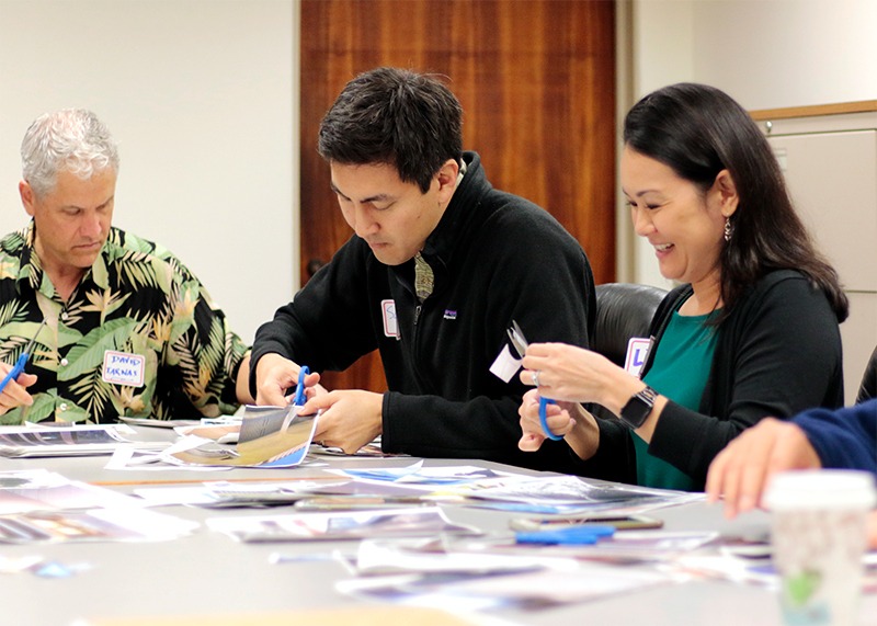 Group of three legislators working on an art project