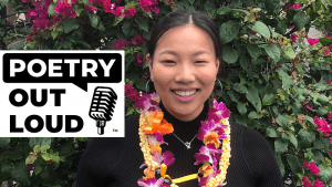 Smiling state champion wearing flower lei.
