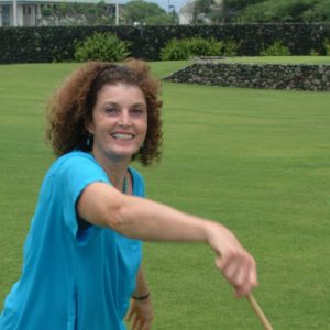 Mauli Ola Cook, smiling in an outdoor setting.