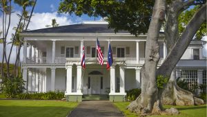 View of the front lawn and entrance to the Washington Place building. 